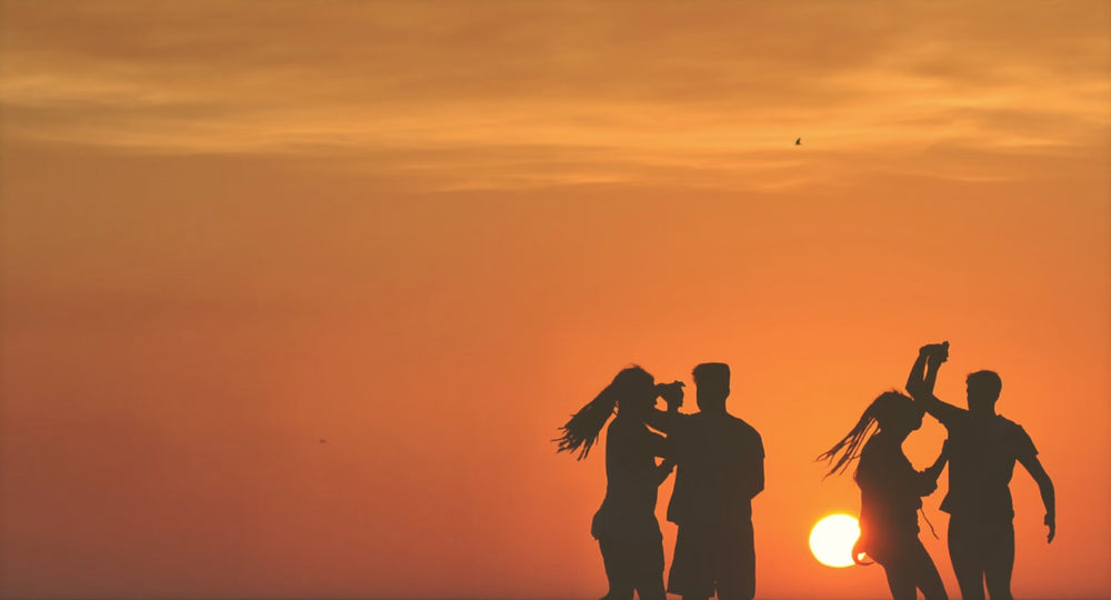 Couples dancing, sunset